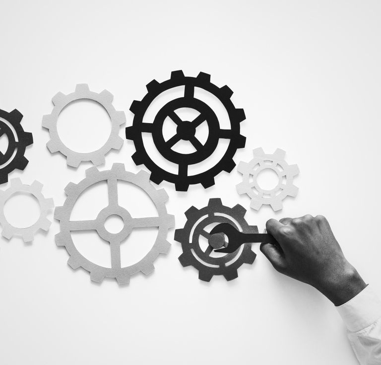 Hand with support gears isolated on white background
