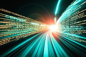 Digital data flow on road with motion blur to create vision of fast speed transfer.