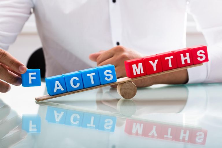 Businessman showing unbalance between facts and myths
