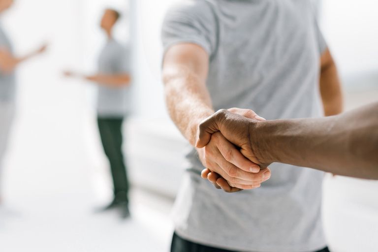 Close up. successful young people shaking hands. photo with copy space
