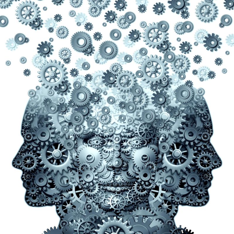 Concept of group working as a team of human heads made of gears and cogs that work together.