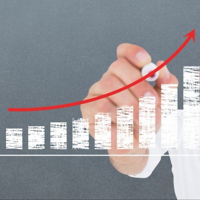 A chart going up and with a red arrow following the curve up. 